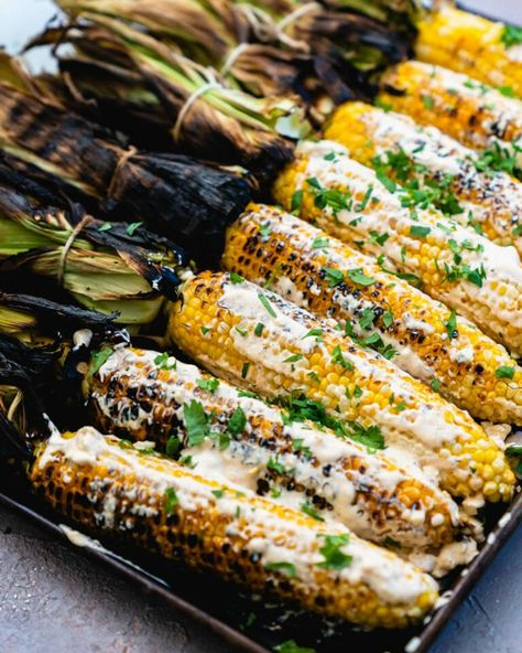 Elote is classic Mexican street corn, grilled and slathered in a irresistible sauce. This recipe has an added bonus: built-in handles for easy eating! #elote #grilledcorn #corn #cornonthecob #mexican Corn Grilled, Elote Recipe, Corn Side Dish, Bbq Menu, Mexican Corn, Side Dishes For Bbq, Couple Cooking, Mexican Street Corn, Street Corn