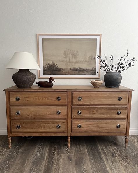 We have lived here for 3 years and I've never been able to style this dresser in a way that I liked it. I finally LOVE how it looks. Dresser styling idea Follow my shop @katewinfordhome on the @shop.LTK app to shop this post and get my exclusive app-only content! #liketkit #LTKstyletip #LTKhome #LTKsalealert @shop.ltk https://liketk.it/4KlYZ Refurbish Old Dresser, Dresser Accent Wall, Minimalist Dresser Styling, Simple Dresser Styling, Wall Above Dresser Decor, Long Dresser Styling, Dresser Decor Under Tv, Dresser With Tv On Top, Dresser In Hallway