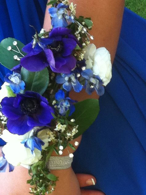 Stunning wrist corsage with blue anemones, delphinium & white ranunculus. crystal accents to add sparkle. Flowers by The Purple Iris, Wendy Sykes - Owner www.thepurpleirisevents.com Iris Corsage, Delphinium White, Prom Flowers Corsage, White Corsage, Wrist Corsages, Jessica Brown, Prom 2014, White Ranunculus, Corsage Prom