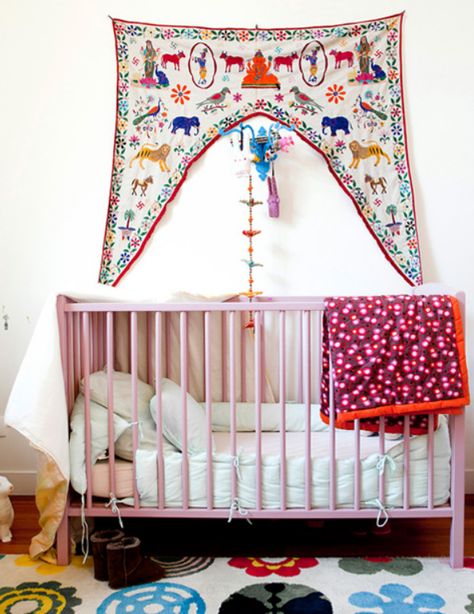 Eclectic, colorful nursery. A definite Bohemian vibe, with the pink crib, multi-colored blankets, & animal wall hanging. This uniquely designed nursery gets an A+. Eclectic Nursery, Bohemian Nursery, Pink Crib, Chic Nursery, Bohemian Baby, Nursery Modern, Bohemian House, Boho Kids, Deco Boheme