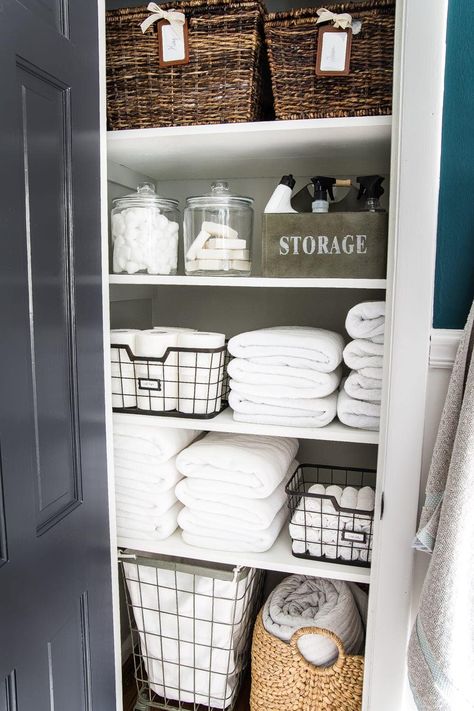 40 Ways to Improve Your Home for Under $100 Diy Bathroom Storage Ideas, Bathroom Linen Closet, Linen Closet Storage, Bathroom Closet Organization, Organizing Linens, Diy Bathroom Storage, Linen Closet Organization, Bathroom Closet, Closet Makeover