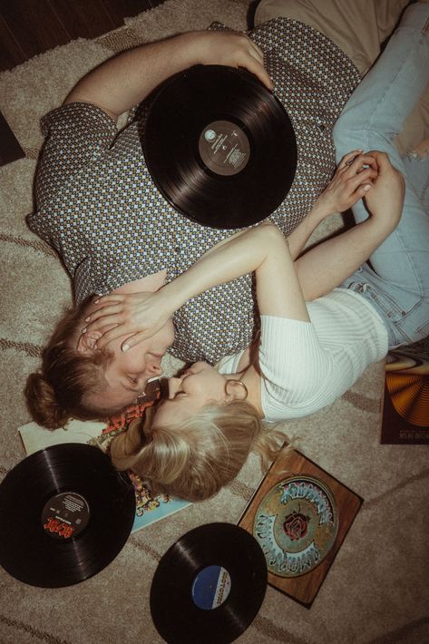 Playful Indoor Engagement Photos in Denver | The couple lies on the floor surrounded by vinyl records for their groovy engagement photos at Disco Den in Denver. See more fun engagement photos retro, retro inspired engagement photos, denver engagement pictures and denver colorado engagement photos. Book McKenzie for your unique engagement session and wedding photography at mckenziebigliazzi.com! Retro Engagement Photos, Colorado Mountain Engagement Photos, Indoor Engagement Photos, Aesthetic Engagement, Engagement Themes, Colorado Engagement Photos, Engagement Session Posing, Fun Engagement Photos, Mountain Engagement Photos