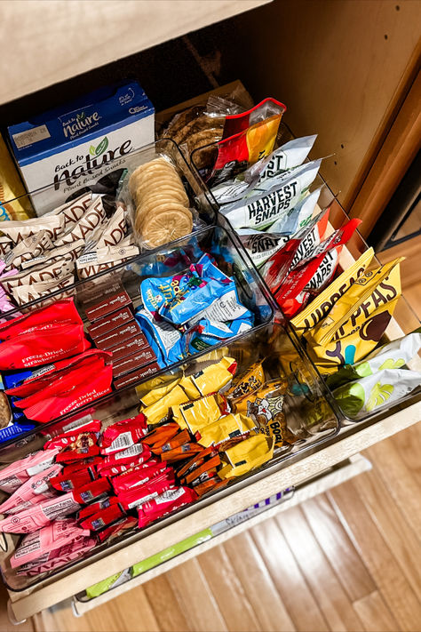 Our unruly snack drawer is now a thing of beauty thanks to unboxing the snacks into clear plastic containers. See more on the blog! Desk Snacks Drawer Healthy, Snack Storage In Bedroom, College Snack Storage, Snacks Organizer Ideas, Organized Snack Drawer, Snacks Storage Ideas, Bedroom Food Storage Ideas, Toddler Snack Drawer, Work Snacks Office Drawer