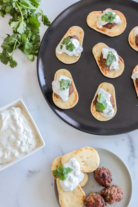 These Mediterranean lamb meatballs are one of my favorite party appetizer recipes! Using ground lamb makes these meatballs super moist and juicy. Serve them over mini pita or naan bread and a drizzle of creamy tzatziki sauce, and your guests will be raving! Greek Lamb Meatballs Recipe, Lamb Gyros With Tzatziki Sauce, Lamb Meatballs Greek Tzatziki Sauce, Greek Lamb Meatballs, Mediterranean Lamb, Party Appetizer Recipes, Lamb Meatballs Greek, Gyro-style Lamb Burgers With Tzatziki And Grilled Onions, Mediterranean Seasoning