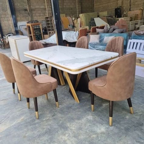 Indulge in luxury dining with our exquisite six-chair dining set and matching console mirror. The perfect blend of coffee brown, cream, gold, and marble tops ensures a stunning addition to your space. Elegant feather-like designed table legs in coffee brown and touches of gold accents make this set truly one-of-a-kind. . . . . . . . . . . . #LuxuryDining #ExquisiteDesign #FurnitureMakers #dining #consolemirror Brown Chairs Dining, Marble Dining Table Design, Console Mirror, Dining Table Design Modern, Brown Dining Table, Table Foldable, Unique Dining Tables, Dining Table Gold, Marble Top Dining Table