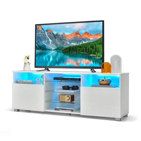 🌟 Elevate your entertainment setup with the Console TV Stand from Storegrill! 🌟 📺 Designed for TVs up to 65", this sleek white stand features LED lights and two doors for stylish storage. Perfect for organizing your media essentials! 🛒 Shop Now: https://storegrill.co.uk/console-tv-stand-for-tvs-up-to-65-with-led-lights-and-2-doors-white/ and transform your living room with StoreGrill! #HomeEntertainment #TVStand #StoreGrillHome #InteriorDesign 📸 Share your stylish setup! Tag @storegrilluk... Console Tv Stand, Tv Stand With Led Lights, Functional Tv Stand, Tv Bank, Led Lighting Diy, Tv Stand Designs, Led Tv Stand, Magic Light, Console Tv