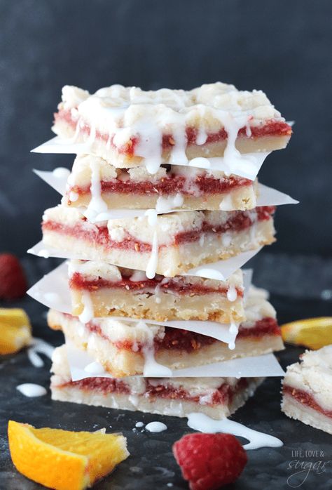 These Raspberry Orange Shortbread Bars are drizzled with a delicious vanilla glaze! They're sweet, fruity dessert bars that are perfect for summer! And to make them even more fun, they're made with juice pulp! #raspberry #orange #shortbread #bars #shortbreadrecipe #raspberrydessert #orangedessert #cookiebars #dessertbars #raspberrybars Raspberry Dessert Bars, Unhealthy Recipes, Life Love And Sugar, Orange Shortbread, Orange Dessert, Smores Dessert, Raspberry Orange, Raspberry Desserts, Shortbread Bars