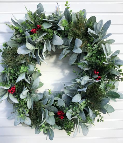 "READY TO SHIP! THIS ITEM WILL BE SHIPPED WITHIN 1 - 3 DAYS OF ORDERING. Holiday Faux Lambs ear and eucalyptus with mixed pine and berries farmhouse wreath This gorgeous grapevine wreath makes a festive and elegant first impression when guests arrive to your home. This lush and full wreath is designed using a combination of assorted greens including faux Lamb's Ear and Eucalyptus. Additional faux mixed pines including faux cypress with red berries are perfectly interspersed around the whole of t Wreath Stand, Wreath Hanger, Lambs Ear, Farmhouse Wreath, Red Berries, Winter Wreath, Door Wreath Hanger, Faux Flowers, Elegant Gift