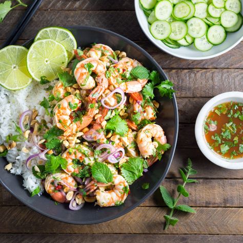 A simple, healthy Thai shrimp salad with an authentic sour-savory-spicy-sweet combination of fresh lime juice, fish sauce and chili paste, showered with fresh herbs and crunchy roasted peanuts. Sum… Spicy Thai Shrimp, Thai Shrimp Salad, Vietnamese Noodle Salad, Chili Garlic Paste, Thai Shrimp, Quick Pickled Cucumbers, Spicy Thai, Thai Cooking, Noodle Salad