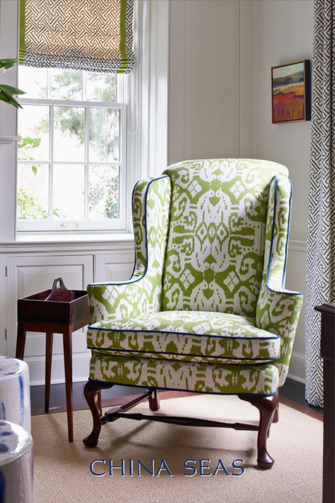 A close-up of the Island Ikat chair in this Gray Walker Interiors design. The vibrant green and white fabric complements the Java Java shades and curtains, creating a stylish and cohesive look.  Explore our Pinterest for more fabric combinations! #GrayWalkerInteriors #IslandIkat #JavaJava #InteriorDesign #CloseUp #HomeDecor #FabricDesign #VibrantLiving #DesignDetails Wing Chair Upholstery, Ikat Chair, Study Interior, Wingback Chairs, Southern Living Homes, Chair And A Half, Home Board, Funky Furniture, Chair Upholstery