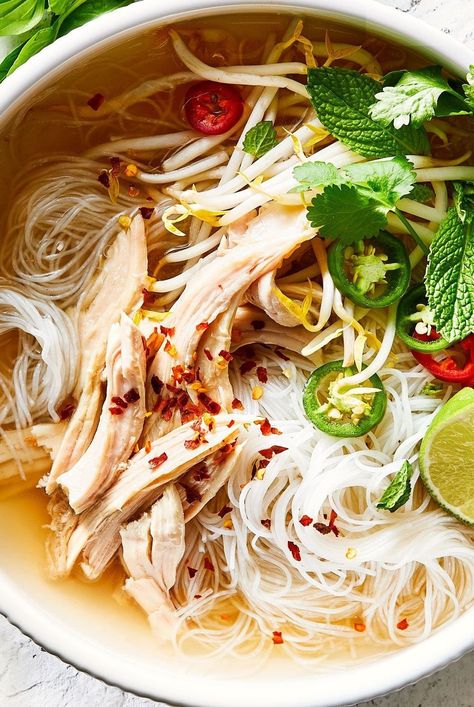 Utilize leftover turkey to make a cozy, warming bowl of pho. The Vietnamese-inspired soup is perfectly spiced. Pile your bowl with plenty of fresh toppings. #leftoverturkeyrecipes #turkeyrecipe #thanksgivingleftovers #bhg Leftover Turkey Pho, Turkey Thai Soup, Soup When Sick, Turkey Pho, Turkey Ramen, Pho Recipes, Turkey Soup Recipes, Pho Soup Recipe, Asian Soup Recipes