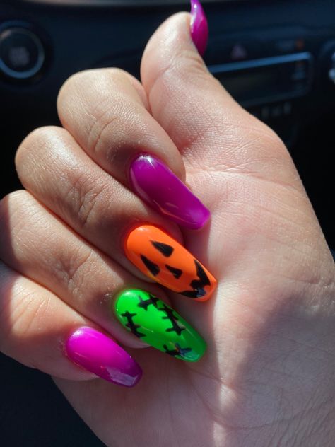 Neon Orange Halloween Nails, Purple And Orange Nail Designs, Orange Purple Nails, Purple Green And Black Nails, Purple Green Orange Nails, Orange Purple Green Nails, Green And Purple Halloween Nails, Purple And Orange Halloween Nails, Neon Halloween Nails