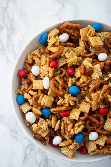 There isn't much better for snacking than this Sweet and Salty snack mix perfect for parties or just snacking at home! Fast, easy party snack recipe. Chex Mix Recipes Sweet 4th Of July, Sweet And Salty Mix Recipes, Patriotic Trail Mix Recipe, Patriotic Chex Mix Recipes, Fourth Of July Trail Mix Recipe, Fourth Of July Chex Mix Recipe, Chec Mix Recipe Sweet, Patriotic Snack Mix Recipes, 4th Of July Trail Mix Recipes