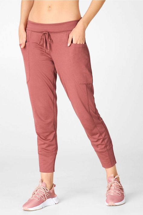 Say hello to your favorite lounge pant, fashioned with a slim-slouch fit and all the pockets you could ever need. Cut from our ultra-lightweight, super-soft washed tricot fabric. Formal Pants Women, Everyday Yoga, Thirty Flirty And Thriving, Female Activewear, Womens Fasion, Womens Outfits, Rest Day, Technical Clothing, Tricot Fabric