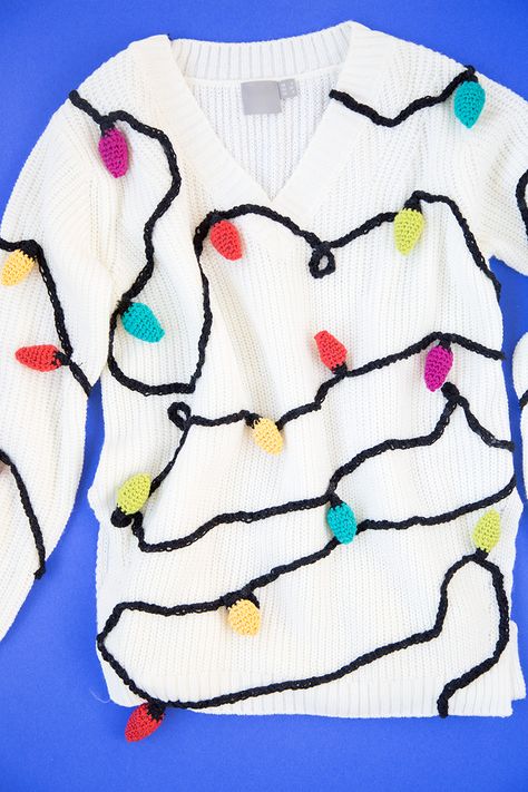 DIY Christmas Lights Sweater | studiodiy.com Crochet Christmas Lights, Diy Christmas Sweater, Diy Ugly Christmas Sweater, Diy Christmas Lights, Tacky Christmas Sweater, Ugly Holiday Sweater, Sweater Ideas, Ugly Xmas Sweater, Colored Lights