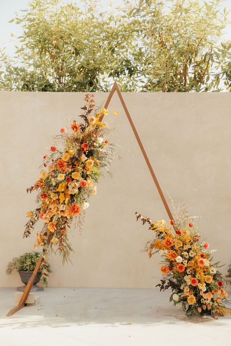 triangle wedding arch decorated in fall flowers Sage Green And Burnt Orange Wedding, Rusty Orange Wedding, Ranunculus Garden, Butterfly Ranunculus, Fall Wedding Arches, Ceremony Florals, Burnt Orange Weddings, Fall Palette, Floral Installations