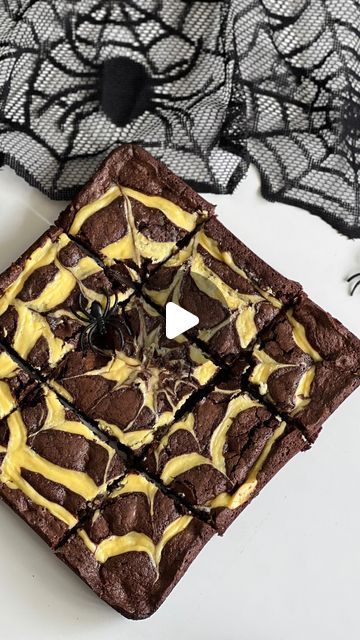 Ashley Lamego ♥ on Instagram: "Spider Web Brownies ✨

2 large eggs 
1/2 cup of butter (melted and cooled) 
3/4 -1 cup of sugar 
1 tsp of vanilla 
1/4 tsp of baking soda 
1/2 cup of all purpose flour 
1/2 cup of unsweetened cocoa powder 
1 cup of chocolate chips 

Cream Cheese Filling: 
1 cup of cream cheese (room temperature)
1 egg yolk 
1 tbsp of flour
3 tbsp of sugqr 

Preheat oven to 350 F 
In a large bowl whisk together butter, sugqr, and vanilla. 
Whisk in egg. 
In a separate bowl combine dry ingredients and slowly add to the wet. 
Fold in the chocolate chips. 
In a separate bowl combine cream cheese, sugar and flour. Mix until smooth and then add in egg yolk. 
Transfer to a piping bag/ a ziplock bag cutting a small hole in the corner of the bag. 
Pour brownie mixture into a greased 9 Spider Web Brownies, Unsweetened Cocoa Powder, Piping Bag, Ziplock Bag, All Purpose Flour, Cream Cheese Filling, Unsweetened Cocoa, Egg Yolk, 1 Egg