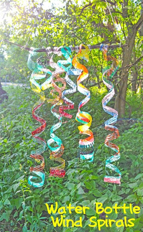 Water Bottle Wind Spiral Craft Tutorial Camping or Outdoor Craft - Here's an easy outdoor craft made with recycled plastic bottles that's perfect for all ages. These Water Bottle Wind Spirals are pretty to hang in the sun. #camping #outdoor #craft Reuse Water Bottles, Water Bottle Crafts, Plastic Bottle Art, Summer Camp Crafts, Bottle Craft, Outdoor Crafts, Kid Craft, Plastic Bottle Crafts, Camping Crafts