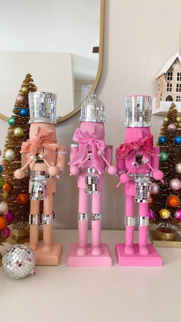 Deborah Trette on Instagram: "diy disco nutcrackers! I picked up wooden craft ones from @michaelsstores, painted with acrylics and attached mirror ball strips! easy but so extra! 💫 make sure to save and share! #diy #diychristmas #christmasdecor #christmascraft #christmasidea #falala #nutcrackers #whimsical #discoball #happyholidays #pinkmas #xmascrafts #makeitwithmichaels #diynutcracker #bhgstylemaker #easydiy #easycraft" Pink Nutcracker Christmas Diy, Girlie Christmas Decor, Pink Whimsical Christmas, Christmas Nutcracker Diy, Christmas 2024 Trends Diy, Pinkmas Diy, Paint Nutcracker Diy, Pink Disco Christmas, Disco Nutcracker