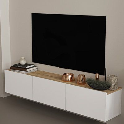 Introducing the Atelier Mobili Floating TV Console, a perfect solution for living room or bedroom TV stands. This floating media console is not only a functional piece but also a stylish addition to your home decor. It offers a modern, sleek, and space-saving design that will free up your floor space, making your room look bigger and more elegant. This floating console not only serves as a TV table but can also be used as a wall shelf, making it a versatile piece for your home. The under-TV floa Floating Cabinet Under Tv, Table Under Tv Decor, Under Mounted Tv Ideas, Shelf Under Tv On Wall, Decor Under Tv Wall Mounted Tv, Under Tv Decor, Decor Under Tv, Wall Mounted Tv Console, Shelf Under Tv