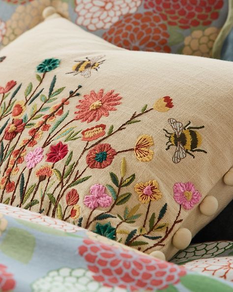 Spring cheer is here, captured in a joyful, butter-yellow pillow cover that buzzes with a garden of colorful botanicals and happy honeybees. Well textured in slubbed cotton, embellished in a mix of embroidery styles, and playfully adorned with pom trim at both ends, it continuously blooms on any chair, couch, bench, or bed.  Embroidered face with unadorned back. Solid pom trim at both ends. Hidden zipper closure. Pillow insert sold separately. Hand Embroidery Pillow Cover, Wildflower Pillow, Couch Bench, Embroidery Styles, Yellow Pillow Covers, Embroidered Pillows, Chair Couch, Bird Pillow, Embroidered Face