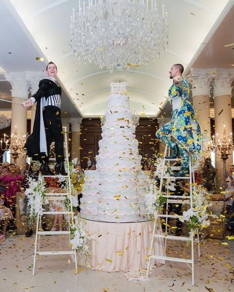 International Event Producers on Instagram: "The post-ceremony brunch was held at @nemacolin and included a shade of blush 💕 To kick off the celebration, the grooms stood on ladders and used sabers to cut their 10 foot wedding cake. 🎂 ⠀⠀⠀⠀⠀⠀⠀⠀⠀ At brunch, @jordanmillingtonliquorice + @pjmagerkoliquorice danced with their mothers and gave the guests “a dose of drag.” PJ told VOGUE, “Most of our guests have never seen a drag show before, so we wanted to give them a taste with some of our favorit Upstage The Bride, Floral Canopy, Drag Show, Beaver Creek Colorado, Event Producer, Beaver Creek, Ceremony Venue, Sweet Couple, Reception Venues