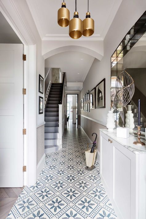 Going for a tile that will stand the test of time in both style and quality is a must when you're looking for patterned floor tiles. The right tile patterns can add colour and pattern to any space #interiors #architecture #hallway Hall Tiles Floor, Tiled Hallway Floor, Hallway Tiles Floor, Hall Tiles, Hall Stairs, Entryway Tile, Stairs Landing, Entryway Flooring, Tiled Hallway