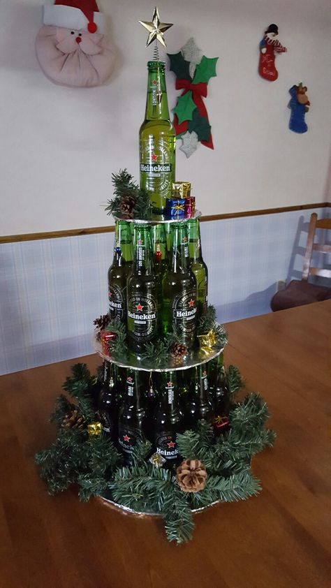 Beer bottle Christmas Tree Beer Bottle Christmas Tree, Christmas Tree Beer Cans, Wine Bottle Christmas Tree Diy, Christmas Tree Wine Bottle, Beer Tree Christmas, Mini Liquor Bottle Christmas Tree, Alcohol Christmas Tree, Beer Can Christmas Tree, Beer Christmas Tree