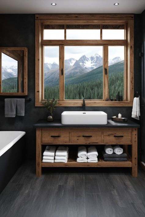 Bring the cozy sophistication of a mountain retreat into your bathroom with dark pine elements and rugged black slate surfaces. Alpine luxury at home. #MountainStyle #LodgeDesign #RusticLuxury Mountain Modern Half Bath, Mountain Theme Bathroom, Modern Cabin Bathroom Ideas, Modern Lodge Bathroom, Dark Rustic Bathroom, Rustic Interior Design Bathroom, Mountain Lodge Bathroom, Lodge Style Bathroom, Wood And Black Bathroom