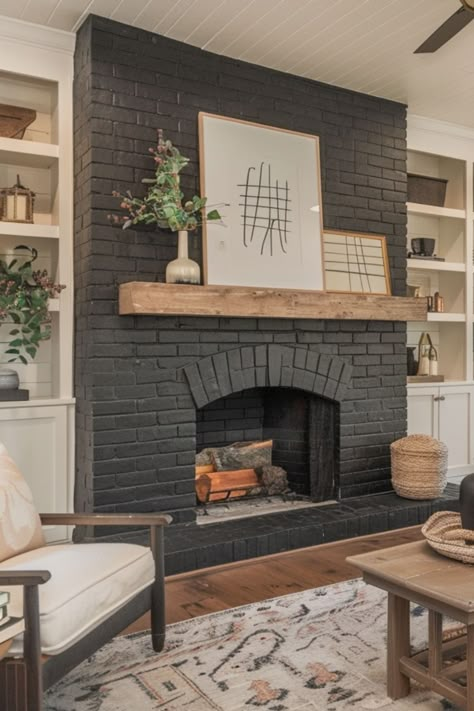 Explore 18 black brick fireplace makeover ideas for your home! A painted black brick fireplace with a wood mantle creates a modern, inviting vibe for any DIY project. Black Brick Fireplace Decor, Redoing Old Brick Fireplace, Mat Black Fireplace, Painted Gray Brick Fireplace, Build Over Brick Fireplace, Modern Black Brick Fireplace, Faux Brick Wall With Fireplace, Painted Brick Entryway, Painting Inside Brick Fireplace