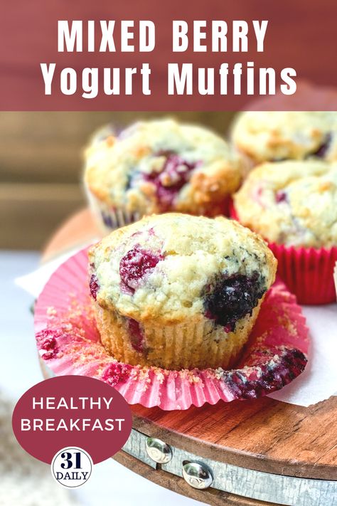 These Mixed Berry Yogurt Muffins are lofty and so moist they almost melt in your mouth. Filled with berries, they are healthy and sweet. This easy recipe is perfect for breakfast, brunch, or a healthy snack. In-season berries are a perfect choice but frozen berries work great too. Be sure to get this recipe at 31daily.com #muffins #berries #mixedberries #brunch #healthysnack #31Daily Greek Yogurt Berry Muffins, Yogurt Berry Muffins, Yogurt Fruit Muffins, Healthy Mixed Berry Muffins, Berry Breakfast Muffins, Mixed Berry Muffins Easy, Frozen Berries Muffins, Fresh Berry Muffins, Mixed Berry Muffins Fresh Berries