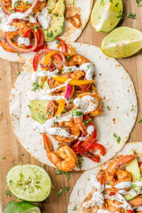 Juicy shrimp as protein in the most delicious homemade seasoning combined with peppers and onion wrapped in warm flour tortillas. Chipotle Lime Shrimp, Shrimp Fajitas Recipe, Shrimp Tortilla, Easy Mexican Dishes, Shrimp Fajita Recipe, Shrimp Wraps, Fajita Marinade, Flavorful Shrimp, Fajitas Recipe