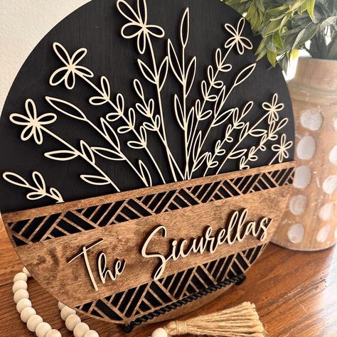 Make any space truly special with our beautifully crafted personalized wood sign. Perfect for housewarmings, bridal showers, or as a unique wedding gift, this sign adds a charming, rustic touch to any home.  Each detail is meticulously laser cut, providing a crisp and clean finish. DOES NOT COME WITH THE SHELF STAND AS SEEN IN THE PICTURES. SIZE OPTIONS: 12 inch: Perfect for shelves or small wall spaces.   15 inch: Ideal for entryways or medium-sized wall areas. 18 inch: Great for larger wall sp Round Door Hangers Last Name, Circle Address Sign, Wooden Laser Projects, Laser Made Gifts, Personalized Welcome Signs, Wood Sign Decor, Laser Cut Wedding Gift, Laser Engraver Projects Ideas, Home Warming Gifts Ideas