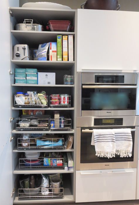 install easy pull-out drawers (these happen to be by simple human) in deep pantry cabinets. make sure each drawer has a specific category; grains, pastas + sauces, tupperware + ziplocks, etc. Pantry Pull Out Drawers, Built In Wet Bar, Shelf Kitchen Cabinets, Entertainment Console Decor, Deep Pantry, Bar Drawer, Entertainment Center Shelf, Tv Stand Furniture, Pantry Cabinets