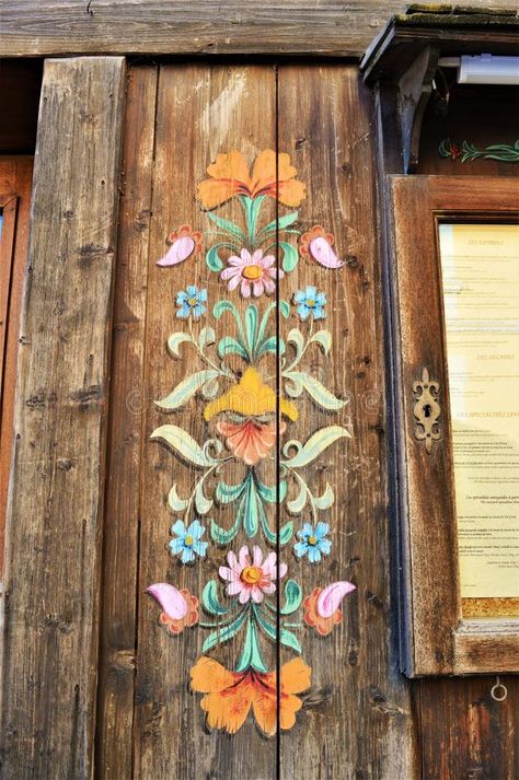 Traditional wood decorations in Swiss Alps. Traditional wood decorations on wood in the beautiful range of Swiss Alps mountains in Switzerland Swiss Decor, Stenciled Doors, Alpine Decor, Wooden Chest Of Drawers, Alps Mountains, Wood Decorations, Folk Decor, Chalet Interior, Swiss Chalet