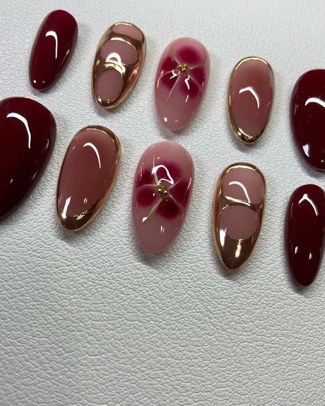 Fall Vibe Created Set Cherry Red & Dark Brown with Gold Chrome 🍁🍂✨ https://naildatebydilacy.etsy.com . . #fallnails #etsyshop #almondnails #press #pressons #brown #fallseason #nailinspiration Red With Gold Design Nails, Brown Red Nails Design, Brown Nail Chrome, Maroon And Cheetah Nails, Cherry Red Nails With Chrome, Cherry Mocha Nails Chrome, Red Nails With Gold Chrome, Wine Red Nails With Gold, Dark Red Gold Nails