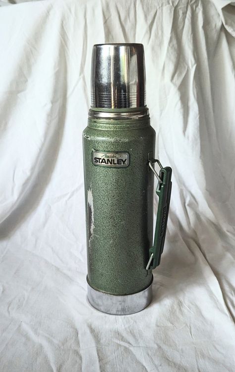 Distressed, vintage thermos bottle  Has cup and pour stopper Vintage Stanley Thermos, Vintage Water Bottle, Vintage Toys 1960's 1950s, Antique Knowledge, Stanley Thermos, Vintage Lampshades, Vintage Toys 1960s, Mystery Film, Vintage Thermos