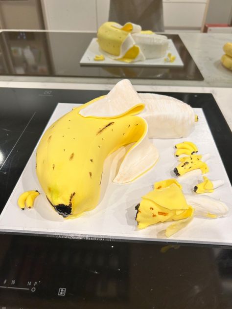 Fondant decorated cake in the shape of a banana. Banana Shaped Cake, Bananas Birthday Party, Banana Theme Cake, Banana Birthday, Banana Themed Birthday Party, Banana Decorated Cake, Banana Party, Banana Cake, Fondant Cake