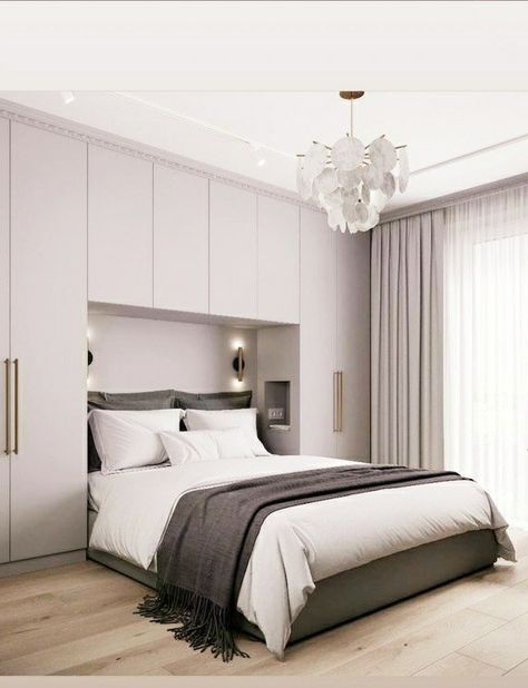 Bed In Front Of Wardrobe, Modular Bed Design With Storage, Built In Headboard Wall Storage, Wardrobe In Front Of Bed, Bed Back Window Wall Design, Wardrobes Over Bed, Cabinets Around Bed, Built In Bedroom Cabinets Around Bed, Built In Wardrobe Around Bed