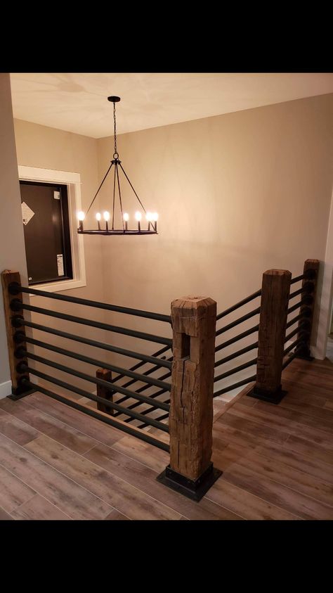 Wrap Around Stairs Interior, Homemade Stair Railing, Boho Railings For Stairs, Railing Inside The House, Rustic Modern Stair Railing, Modern Rustic Stair Railing, Industrial Farmhouse Stair Railing, Floor To Ceiling Banister, Metal And Wood Railings Indoor