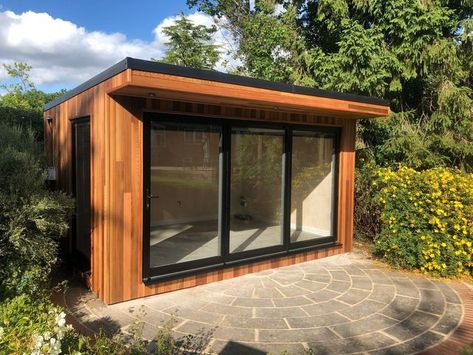 Bucks Garden Rooms on Instagram: "Doesn't cedar cladding look stunning in this sunshine? This beautiful 4.5m x 3m model workshop garden room was recently installed for our fabulous customers in Speen! Our team took the time to build it perfectly central on the customers existing patio, now that takes some skill! 🌿4.5m X 3m Garden Room 🌿Cedar Cladding 🌿Bifold Doors 🌿Single Vision Panel Window 🌿Full Electrics 🌿Internal Spotlights 🌿External Spotlights 🌿Internet Cable 🌿800mm Overhang 🌿Blin Contemporary Garden Rooms, Insulated Garden Room, Larch Cladding, Garden Cabins, Cedar Garden, Cedar Cladding, Northern England, Garden Rooms, Contemporary Garden