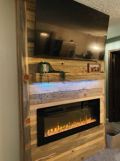 Reclaimed Wood Wall With Tv, Shiplap Fireplace With Wood Mantle And Tv, Rustic Basement Fireplace Ideas, Rustic Tv Wall Ideas Mounted Tv, Electric Fireplace With Wood Surround, Wood Panel Wall With Tv And Fireplace, Electric Fireplace Feature Wall, Led Fireplace Ideas, Rustic Electric Fireplace Ideas