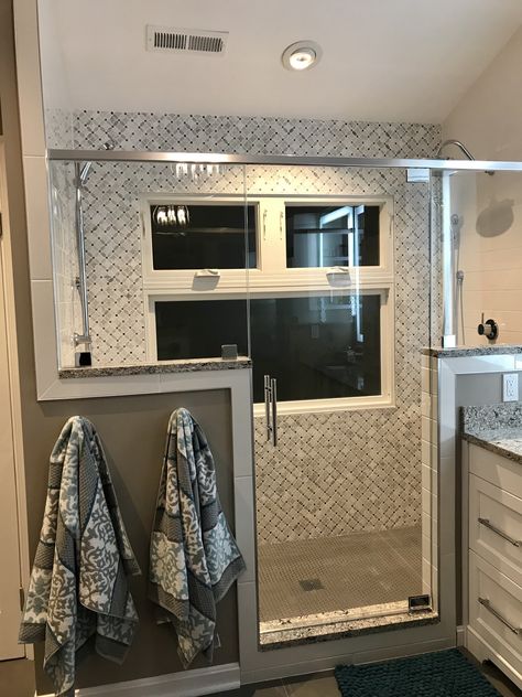 We were so confused about what to do with the window in the shower! A trip to Home Depot and a plan was all it took. Privacy glass on the bottom, clear glass in the two transom windows, vinyl encasement, caulk with grout and a good contractor! We are very happy with all the natural light we still get! Shower With Window Remodel, Shower Stall With Window, Shower Privacy Ideas, Window Pane Shower Door Bathroom, Shower With Window In It, Shower Door With Transom, Window Pane Shower Door, Shower With Half Wall And Glass Panel, Bathroom Shower Transom Window