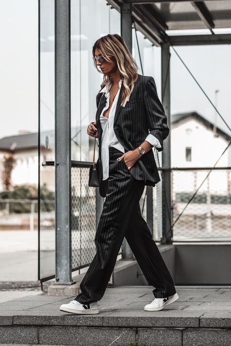 Obsessed with how these sneakers match to a suit... Click to find 11 Sneakers To Invest In Right Now For 2020 « Jennysgou  #women #suit #sneakers #veja # streetstyle #citystyle #stripedsuit Sneakers With Formal Wear, Suits And Jordans Women, Suits And Tennis Shoes Women, Sneakers Suits Women, Pant Suit And Sneakers Women, Pant Suit With Tennis Shoes, Black Suit With Sneakers Woman, Trouser With Sneakers Women, Tux And Sneakers