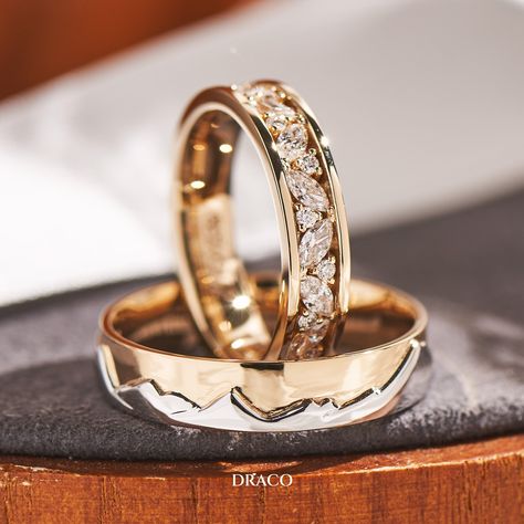 Our latest wedding band set features a bright cut pave ring in 18K yellow gold for her, adorned with alternating marquise and round diamonds. For him, a duo-tone ring with a White gold mountain motif backed by a sky of yellow gold. These custom-made rings make a unique and powerful statement of love and commitment. Wedding Rings Sets His And Hers Gold, Masc Lesbian Wedding Ring, Wedding Bands His And Hers Unique, Wedding Rings Sets His And Hers Unique, Wedding Ring Ideas Unique, Couple Rings Design Unique, Wedding Rings Couple, His And Hers Wedding Bands, Unique Diamond Wedding Bands