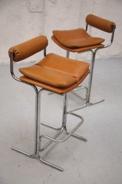 A Pair of Pieff Bar Stools A great pair of stools by Pieff, Worcestershire. Circa 1970. Brown leather seats and backs with chrome frames. The leather is quite stiff and firm, but still in good conditi Modern Leather Bar Stools, Mid Century Bar Stools Kitchen, Bar Stool And Dining Chair, Post Modern Bar Stools, Bar Stools Vintage, 70s Bar Stools, Mid Century Stool, Cool Bar Stools Modern, Apartment Bar Stools