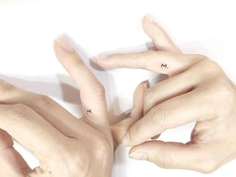 Love Ring Tattoo, Under Ring Tattoo, Small Letter Tattoo Ring Finger, Dainty Marriage Tattoos, Minimalist Wedding Band Tattoo, Delicate Ring Finger Tattoo, Small Couple Tattoos Marriage Ring Finger, Initial Ring Tattoo Wedding Bands, Inner Ring Finger Tattoo