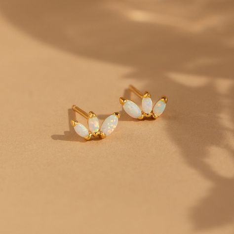 Add some floral fun to your jewelry collection with our Opal Flower Stud Earrings. Whether you're headed to the beach or a picnic in the park, these earrings add a dash of playfulness to your outfit. Material: High Quality Solid 925 Sterling Silver Finish: 18K Gold ∙ Sterling Silver Featuring dainty Floral Stud Earrings with ~3.5mm-4.5mm High Quality CZ Opal Stones Sold as a Pair Part of our Opal Collection Model showcases a fun & bold earring look featuring our Starburst Huggies and Opal Huggie Fun Stud Earrings, Caitlyn Minimalist, Initial Tag Necklace, Sideways Initial Necklace, Pretty Ear Piercings, Opal Stud Earrings, My Wallet, Floral Studs, Bold Earrings