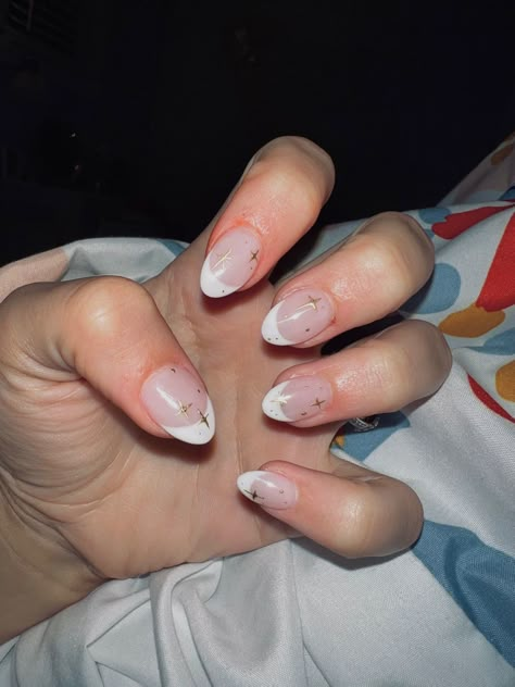 Photo of someone’s hand showing their nails with white French tips and gold sparkles drawn on every nail. White French Tip With Gold, Acrylic Nails White French Tip, French Tip Gold, French Tip With Gold, Gold Nails French, Gold French Nails, Sparkly French Tip Nails, Sparkly French Tips, Nails White French Tip