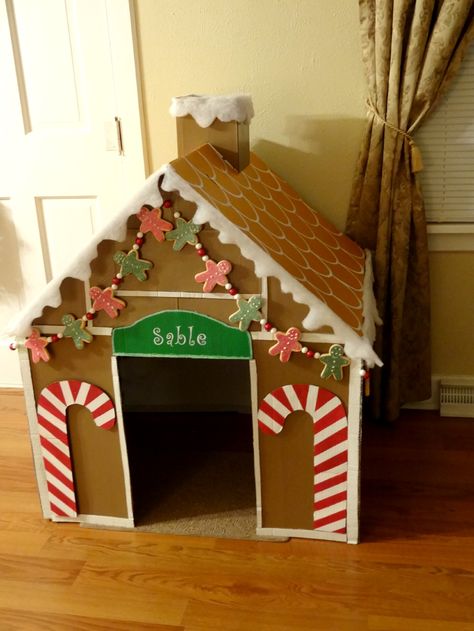 I wanted to decorate my dogs crate for Christmas so I built this Gingerbread dog house from a cardboard box. She can use it as an indoor dog house or I can use it to cover her crate when we have company over! Decoracion Navidad Diy, Gingerbread Dog, Cardboard Gingerbread House, Ginger Bread House Diy, Gingerbread Diy, Gingerbread Christmas Decor, Dog House Diy, Cardboard House, Christmas Parade